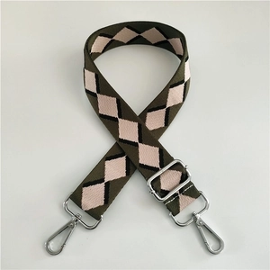 Detail of army green argyle jacquard strap with polished silver metal swivel hooks