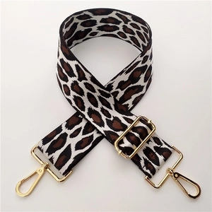 Close-up of 5cm wide leopard print jacquard strap with polished gold lobster clasps