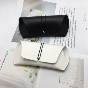 Detail of black and beige PU leather sunglass cases with elastic cord and metal beads