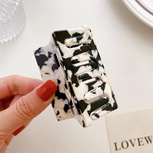 Elegant rectangle acetate hair claw clip with black and white marble ink texture