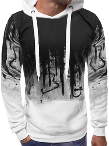 Close-up of men's hoodie showing black and white ink splash print and kangaroo pocket