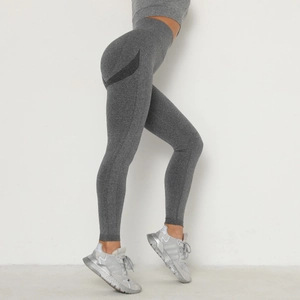 High waisted dark grey seamless yoga leggings with ribbed texture and contouring details