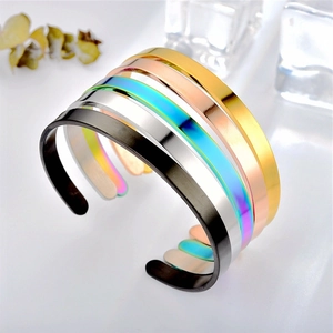 Group shot of polished stainless steel C-shaped bracelets in five metallic colors