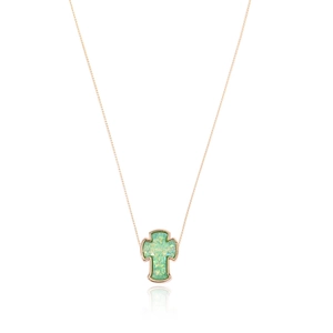 Close-up of rose gold cross necklace featuring a vibrant green opal stone inlay