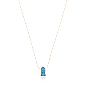 Detail of rose gold necklace featuring a shimmering blue opal mermaid fish pendant