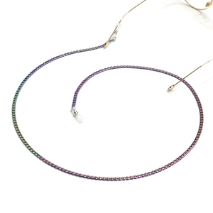 Rainbow gradient metal glasses chain with non-slip silicone loops on white background