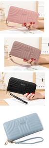Vertical display of long quilted wallets in pink, mauve, black, and light blue colors