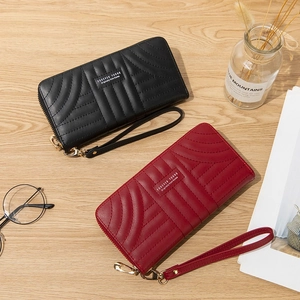 Elegant long zipper wallet for women in matte PU leather with stylish quilted wavy patterns