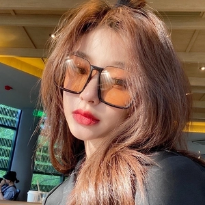 Retro oversized square sunglasses with black frame and orange lenses for stylish look