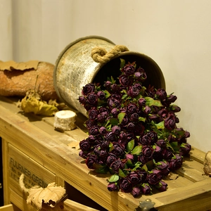 Vintage dark purple silk rose bouquet in rustic metal bucket for home decoration