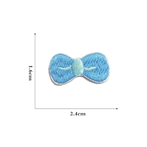 Detailed view of a mini blue embroidered bow patch with 2.4cm width dimensions