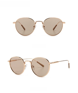 Detailed front and side views of stylish round metal sunglasses in rose gold and pink