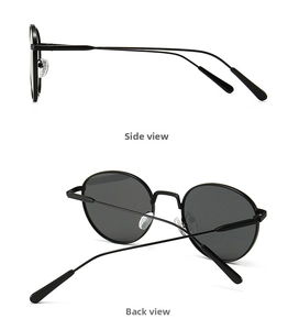 Detail view of round metal sunglasses with dark lenses from side and back angles