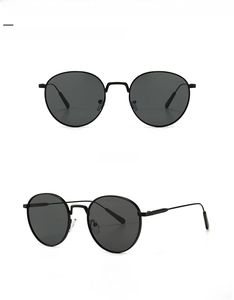 Front and 45-degree angle views of vintage round metal sunglasses with black lenses