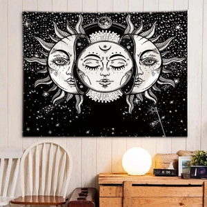 Detail view of Boho mystical skull tapestry with sun and moon motifs on a bedroom wall