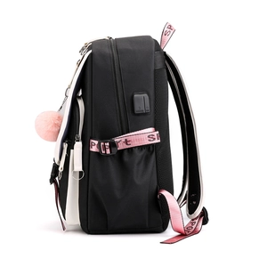 Black Oxford backpack with USB port, pink sport straps and fluffy charm on white background