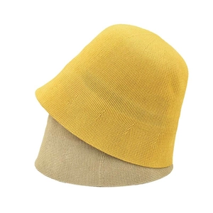 Women's knitted bucket hat in yellow and beige, minimalist dome shape for summer style