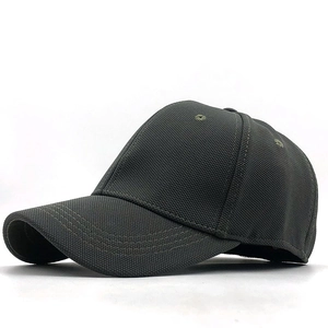 Side view of dark grey baseball cap showing six-panel structure and breathable eyelets