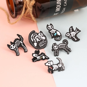 Set of 7 monochrome enamel skull animal pins featuring cat, dog, bird, and rabbit designs