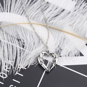 Elegant silver heart pendant necklace with wing wings engraving on soft white feathers