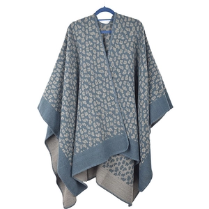 Detail showing high-quality hemmed edges and leopard print on navy knit shawl