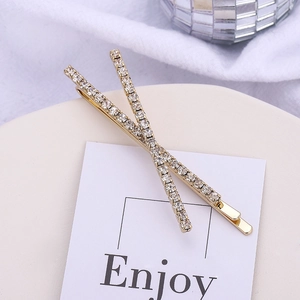 Elegant gold X-shaped crisscross hair clips with shimmering white rhinestones for women