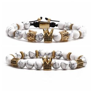 Tiger eye marble bead bracelet set with golden crown charms and black zircon accents
