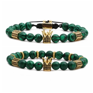 Green malachite beaded bracelet set with golden crown and black zircon accents