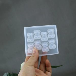 Close-up of translucent 8-cavity bear silicone mold for DIY resin and candle making
