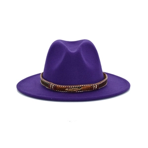 Dark purple wool fedora hat with wide brim featuring a beaded ethnic band and gold feather