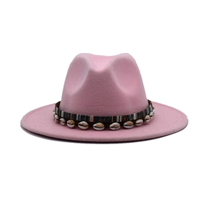 Pink wide brim fedora hat with colorful ribbon and dangling shell charms detail