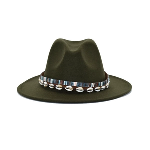 Detail of dark green fedora hat featuring ethnic woven band and natural seashells