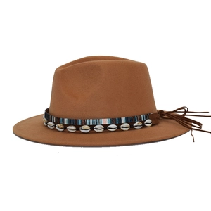 Brown wide brim fedora hat with ethnic woven band, shell charms and long tassels