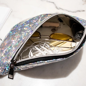 Holographic sequin waist bag for women showing interior space for phone and makeup