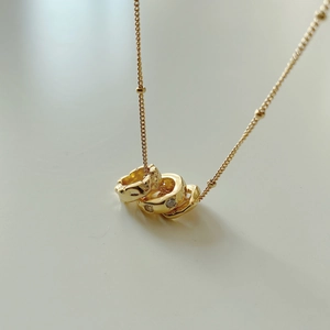 Elegant 925 silver necklace with interlocking triple ring pendant and zircon accents
