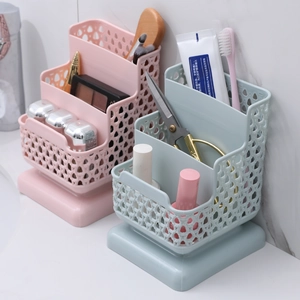 Three-tier hollow plastic organizer basket set in pink and blue for desktop storage