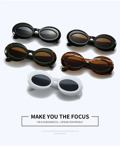 Macro detail showing vintage oval sunglasses in diverse colors with sleek plastic frames