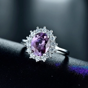 Elegant 925 silver ring featuring a large oval purple amethyst surrounded by white zircons