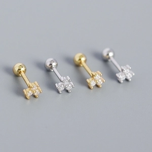Detailed macro view of S925 silver stud earrings with sparkling cubic zirconia flower design