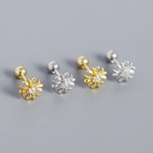 Close-up of gold and silver S925 cross earrings with sparkling zircon and screw backs