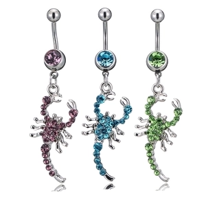 Three scorpion navel rings with purple blue and green rhinestones on white background