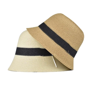 Straw bucket hats in beige and khaki with black ribbon trim for summer sun protection