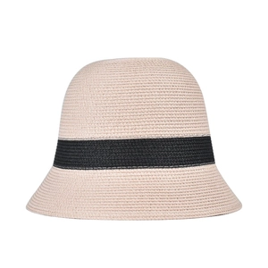 Detailed close-up of a beige straw bucket hat featuring a chic black stripe.
