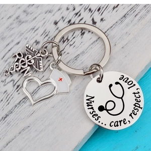 Nurse appreciation stainless steel keychain with RN caduceus and stethoscope charms