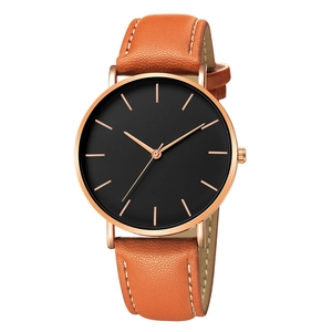 Minimalist quartz watch with rose gold case, black dial and orange leather strap