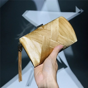 Elegant gold satin evening clutch bag with vertical pleats and metallic tassel decoration