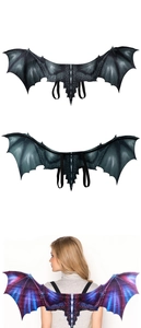 Detail of dragon wings costume with textured scales and elastic shoulder straps