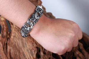 Close-up of men's punk skull bracelet in oxidized stainless steel on a male wrist