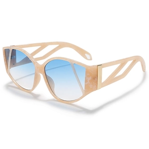 Cat-eye sunglasses with beige marble frame, blue gradient lenses and gold geometric hinge