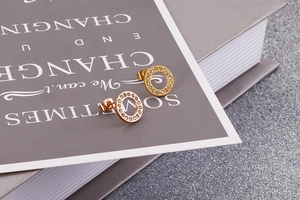 Close-up of rose gold hollow circle stud earrings with pave set clear cubic zirconia